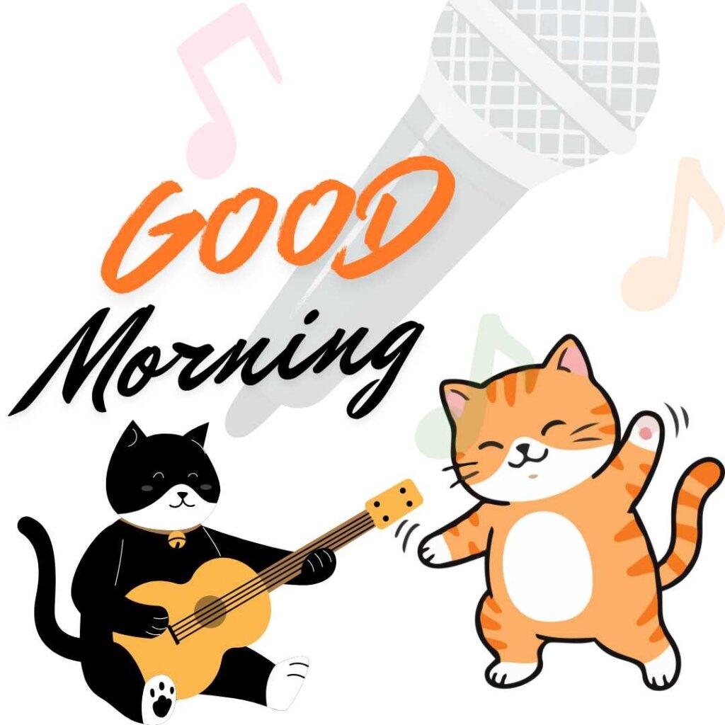 Cute black cat playing an acoustic guitar next to a dancing orange tabby cat with music notes and Good Morning text