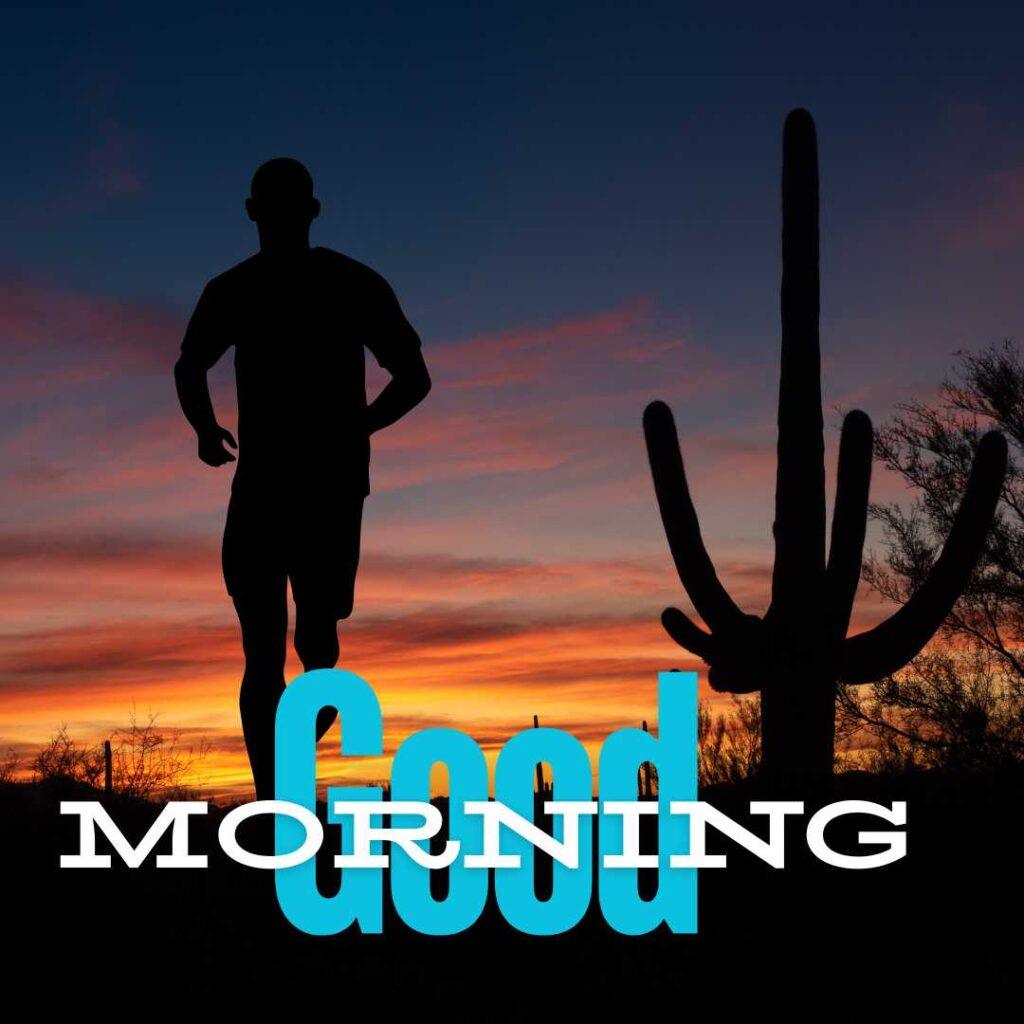 Silhouette of a man jogging in a desert landscape next to a large Saguaro cactus during a dramatic orange sunrise with Good Morning text.