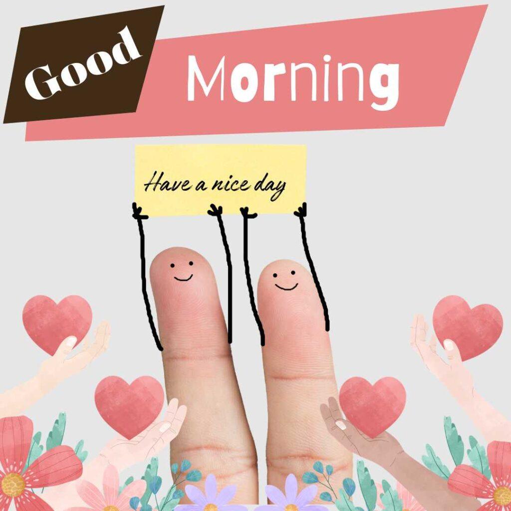 Cute finger art characters with smiley faces holding a "Have a nice day" sign, featuring a "Good Morning" greeting background with pink hearts and flowers.