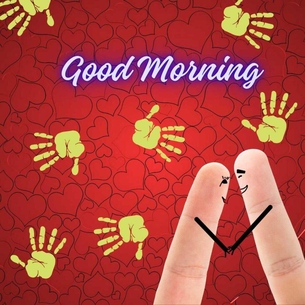 Two finger art characters looking at each other lovingly, set against a red background filled with outlined hearts and yellow handprints.