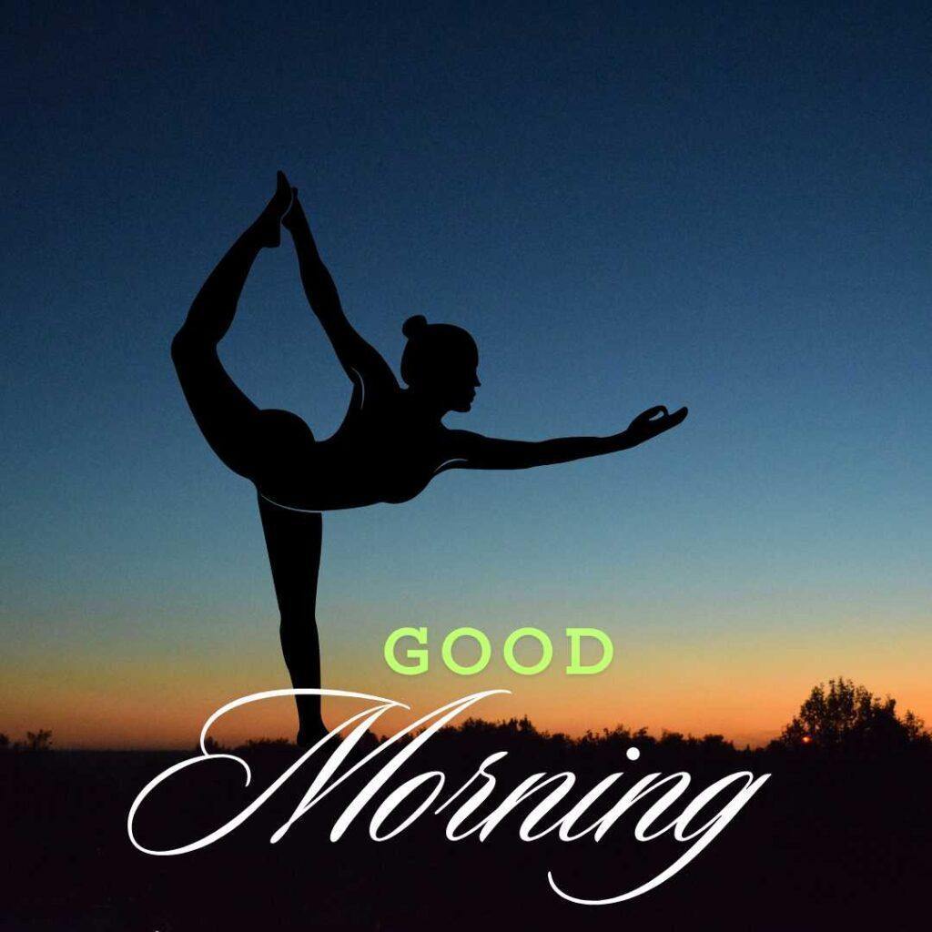 A silhouette of a woman practicing a yoga lord of the dance pose against a beautiful sunrise sky with Good Morning text.