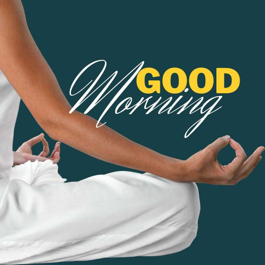 Close-up of a person in white clothing sitting in a meditation pose with hands in Gyan Mudra against a solid dark teal background with Good Morning text.