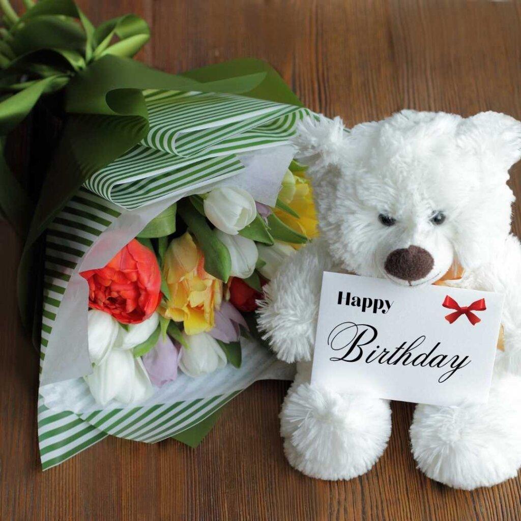 focus happy birthday wishes cute teddy bear with tulips birthday wish.jpg